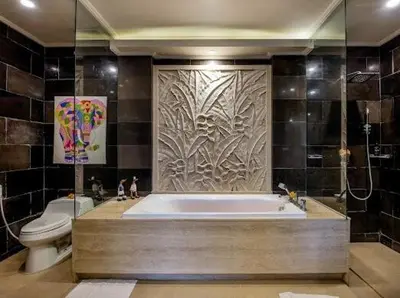 a bathroom with a bath tub and a toilet at villa dreamland beach 300 meter private walk in Jimbaran