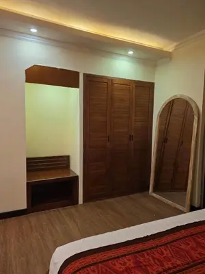 a bedroom with a mirror and a bed and a dressing room at villa dreamland beach 300 meter private walk in Jimbaran