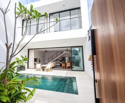 an external view of a house with a swimming pool at Villa Kenia 1 in Umalas, near Canggu in Canggu