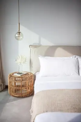 a bedroom with two beds and a wicker table at Villa Kenia 1 in Umalas, near Canggu in Canggu