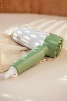 a green and white toothbrush sitting on a table at Villa Kenia 1 in Umalas, near Canggu in Canggu