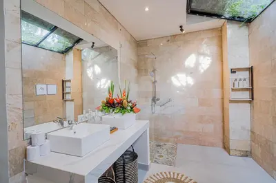 a bathroom with a sink and a shower at Villa Orchid Heaven by Bali Villa Solutions in Seminyak