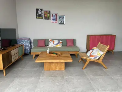 a living room with a couch and two chairs at Rumah Melissa - Modern Boho 3BR Brand New Villa in Sanur in Sanur