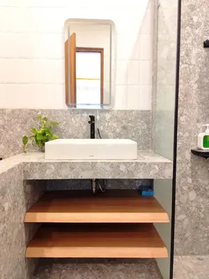 a bathroom with a sink and a mirror at Coconut Villa in Kerobokan