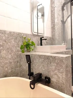 a bathroom with a sink and a mirror at Coconut Villa in Kerobokan