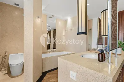 a bathroom with a toilet and a sink at The Koral by Kozystay - Seminyak in Kuta