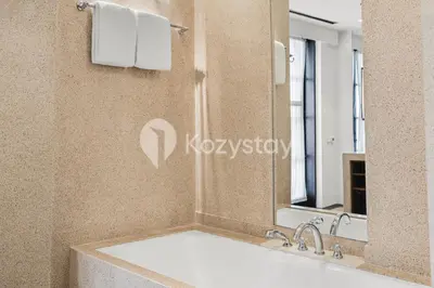 a bathroom with a large sink and a mirror at The Koral by Kozystay - Seminyak in Kuta
