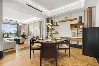 a dining room and living room with a table and chairs at The Koral by Kozystay - Seminyak in Kuta