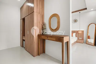 a bedroom with a dressing table and a mirror at Sadin Villa by Kozystay - Umalas in Kerobokan