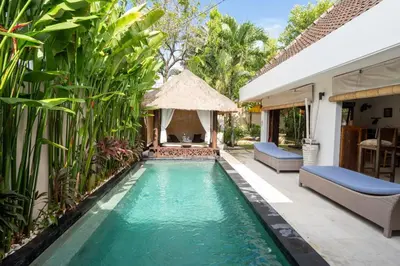 a swimming pool in the backyard of a villa at Kangin villa 2 bedrooms in the heart of Seminyak in Kuta