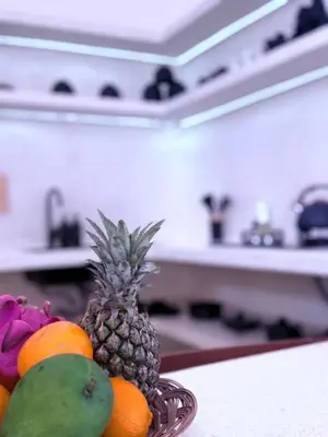 a bowl of fruit on a table in a kitchen at Villa Grand in Sanur