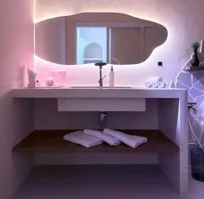a bathroom with a sink and a mirror at Villa Grand in Sanur