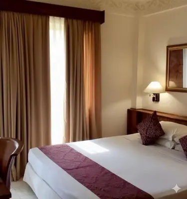 a bedroom with a large bed and a window at Jayakarta Service Apartments in Seminyak