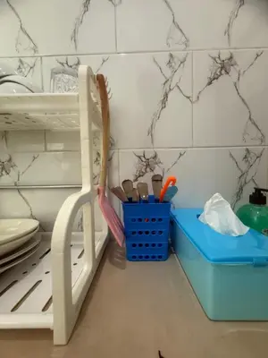 a toy kitchen with a shelf with utensils in it at Private Room In Bali 10Mints To Sanur Beach in Sanur