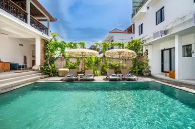 a swimming pool in the backyard of a house at Uma Katani in Jimbaran