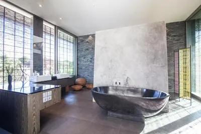 a large bathroom with a tub and a sink at Modern 4BD Villa with Pool in Seminyak