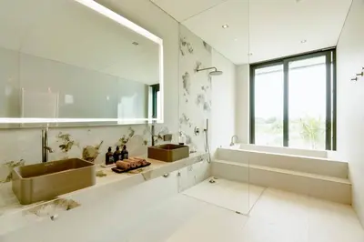 a bathroom with two sinks and a large mirror at Ultra-Luxe 4BR Seminyak Villa - Indoor AC Living & Private Pool in Seminyak