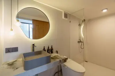a bathroom with a sink and a mirror at Ultra-Luxe 4BR Seminyak Villa - Indoor AC Living & Private Pool in Seminyak