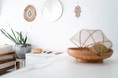a table with a basket and a mirror on the wall at Charming 3 BR villa in the heart of Umalas in Canggu