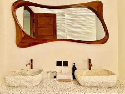 a bathroom with two sinks and a large mirror at House of Rakiki Legian - 2BR Private Pool Villa in Central Legian close to Beach in Legian