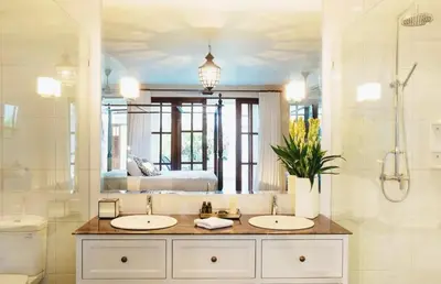 a bathroom with two sinks and a large mirror at Seminyak Pool Villa in Seminyak