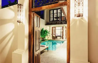 an open door leading to a swimming pool in a house at Seminyak Pool Villa in Seminyak