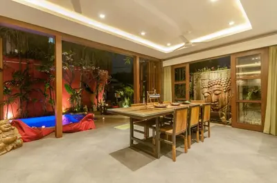 a dining room with a table and some plants at A Luxurious Boutique Villa in Seminyak's Heart in Seminyak