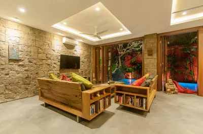 a living room with a couch and a tv at A Luxurious Boutique Villa in Seminyak's Heart in Seminyak
