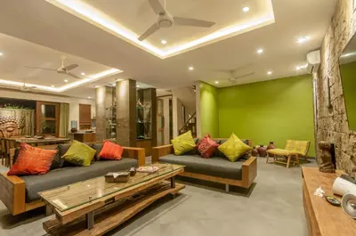 a living room with two couches and a green wall at A Luxurious Boutique Villa in Seminyak's Heart in Seminyak