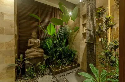 a garden with a statue in a room with plants at A Luxurious Boutique Villa in Seminyak's Heart in Seminyak