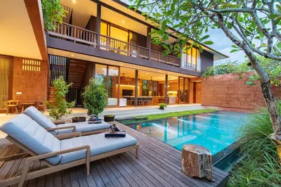 a house with a swimming pool in front of it at Luxury Rosa Village - 4 Bedrooms Walkable to Beach in Jimbaran