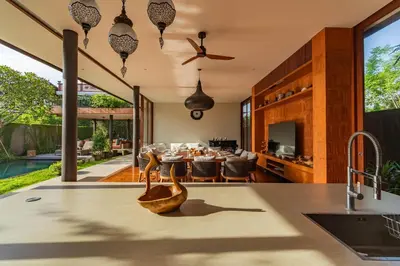an open kitchen and living room with a dining area at Luxury Rosa Village - 4 Bedrooms Walkable to Beach in Jimbaran