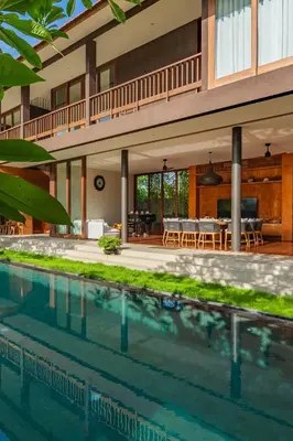 an external view of a house with a swimming pool at Luxury Rosa Village - 4 Bedrooms Walkable to Beach in Jimbaran