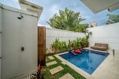 a swimming pool in the backyard of a house at Luxury 2BR Villas in Seminyak Central in Seminyak