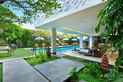 a swimming pool in the backyard of a house at Varnika Peaceful 1 BR Suite Double Room in Kerobokan