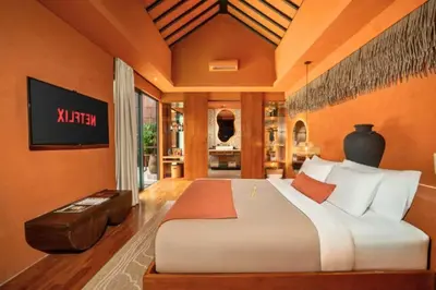 a bedroom with a large bed in a room at Yaseera Aesthetic 1 BR Grand Smart Private Pool Villa in Seminyak