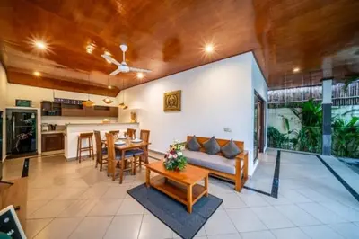 a living room with a couch and a table at Prime Seminyak 2BR Villas in Seminyak