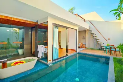 a swimming pool with a tub in a house at Tarasari Stunning 1 BR Grand Private Pool Villa With Bathtub in Seminyak