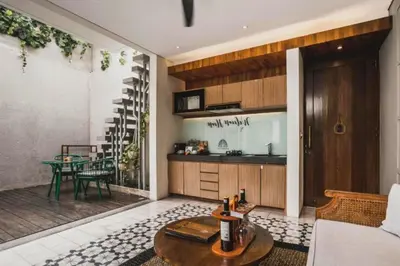 a living room with a couch and a table at Tarasari Stunning 1 BR Grand Private Pool Villa With Bathtub in Seminyak