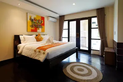a bedroom with a large bed in a room at 6 Bedrooms Pool Twin Villa in West Sanur in Sanur
