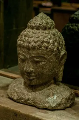 a stone statue of a head on a table at 6 BDR Boutique villa in heart of Seminyak in Seminyak