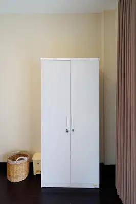 a white cabinet in a room with a curtain at 3Bedrooms Villa with Pool West Sanur - Casa Del Sol in Sanur