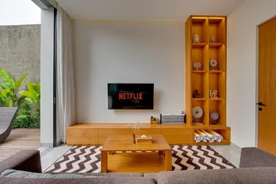 a living room with a couch and a table at Elegant Villa Vibhava 2BR in Central Umalas in Kerobokan