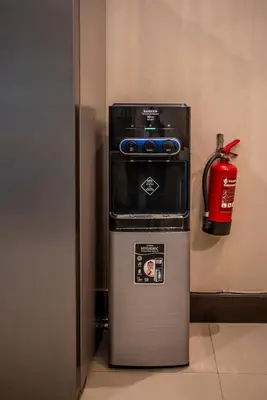 a fire hydrant sitting next to a refrigerator at Villa Aditya Seminyak in Seminyak
