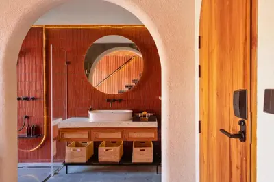 a bathroom with a sink and a mirror at Tamasvini Romantic 1 BR Grand Private Pool Villa With Bathtub in Seminyak