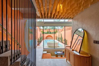 a house with a pool in the middle of a hallway at Tamasvini Romantic 1 BR Grand Private Pool Villa With Bathtub in Seminyak