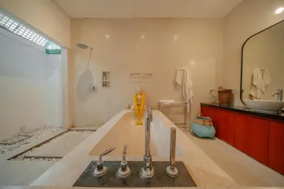 a bathroom with a bath tub and a sink at Stunning villa in Umalas center in Canggu