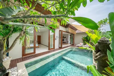 an outdoor swimming pool in a villa at 2min-walk beach Atlas club,Finns Padi view in Canggu