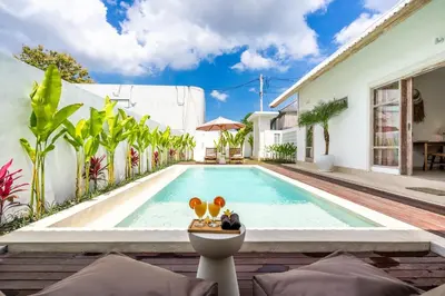 a swimming pool in the backyard of a house at Blush Elegance 2 BR Villa in Umalas in Canggu