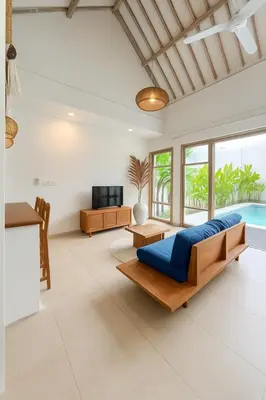 a living room with a bed and a pool at Blush Elegance 2 BR Villa in Umalas in Canggu